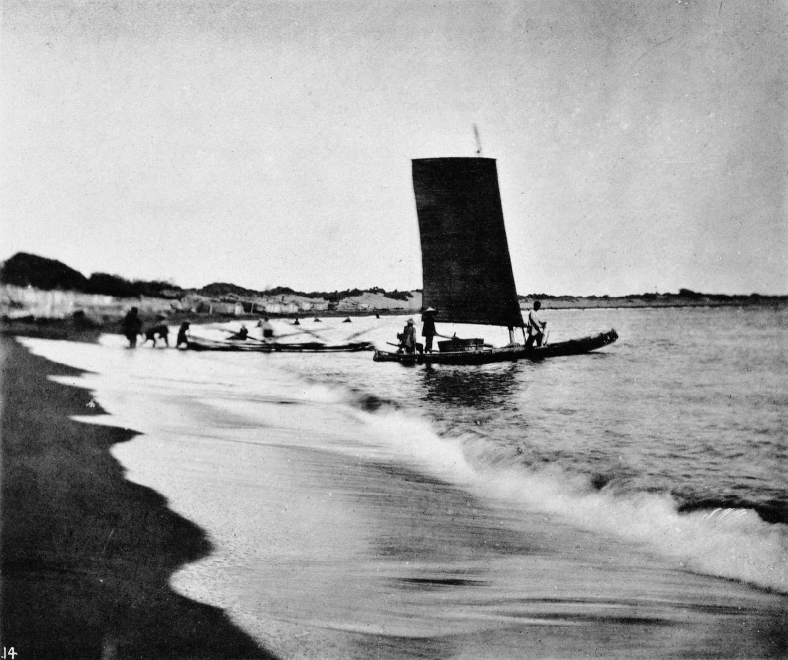 A bamboo raft photographed by Thomson. The west coast had no deep-water harbour, and cargo moved between ship and shore on shallow craft like this.