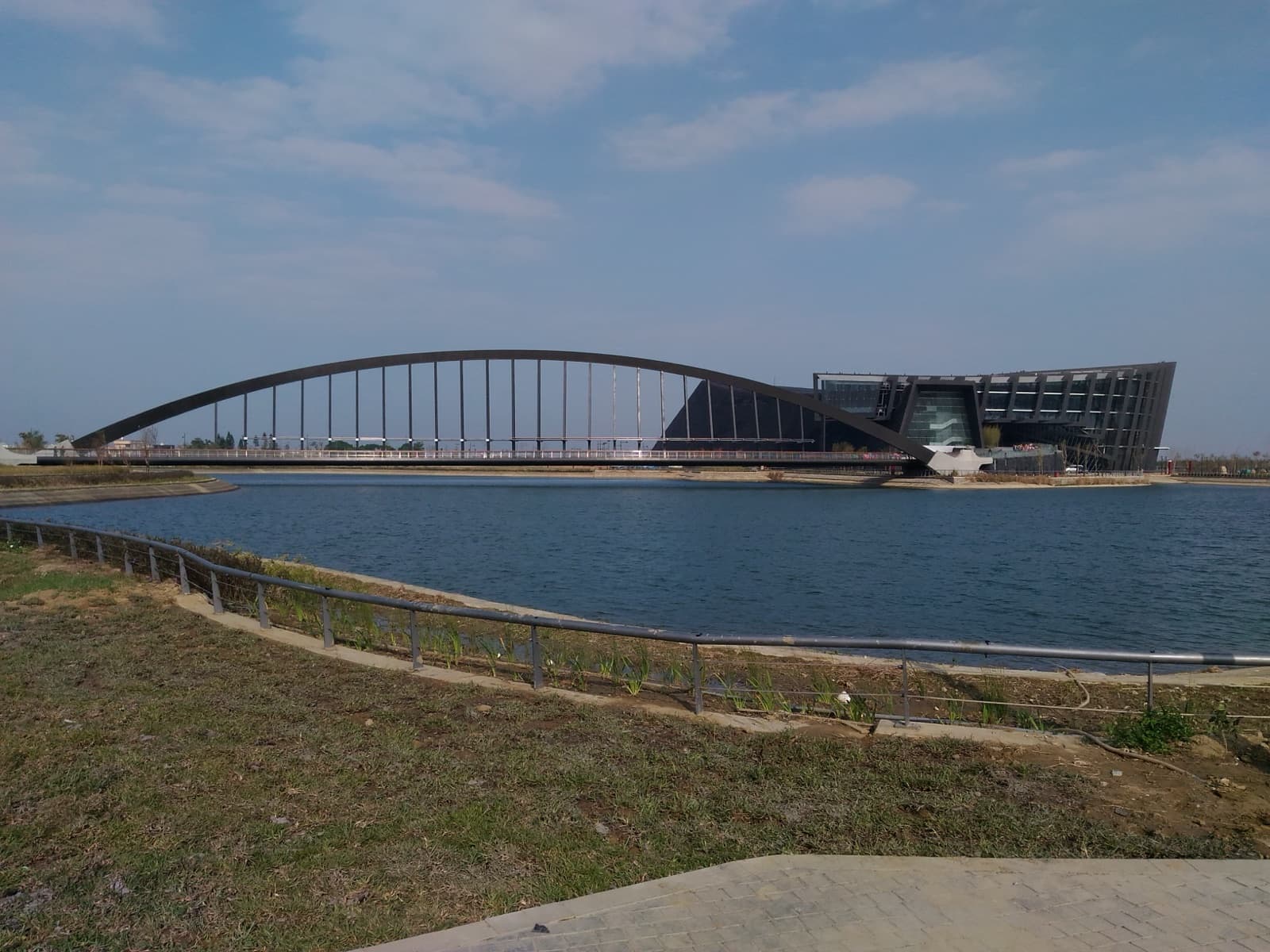 The main building of the National Palace Museum's Southern Branch with the Zhimei bridge, in its opening year of 2015. Sited at Taibao in Chiayi, it answered a policy question: whether the museum belonged only to Taipei.