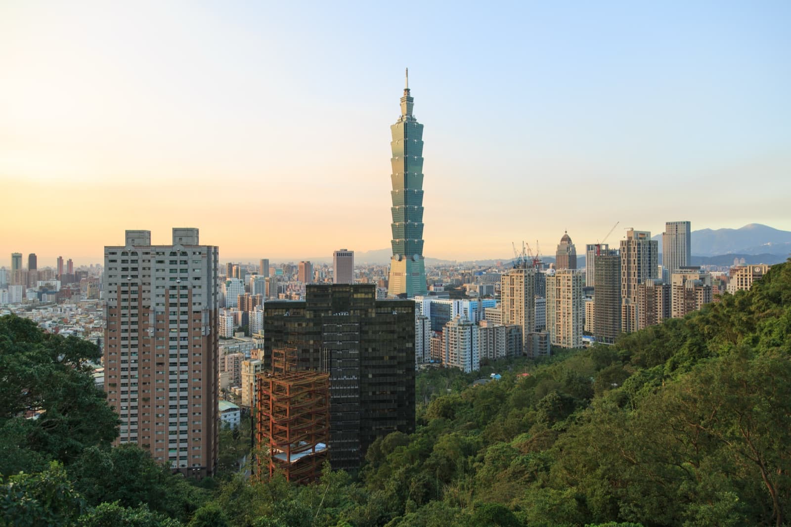 The tower itself: eight tapered sections stacked one on the next, drawn from bamboo joints and Chinese vessels. It was the first time Taiwan built its own image into a landmark the world would recognise.
