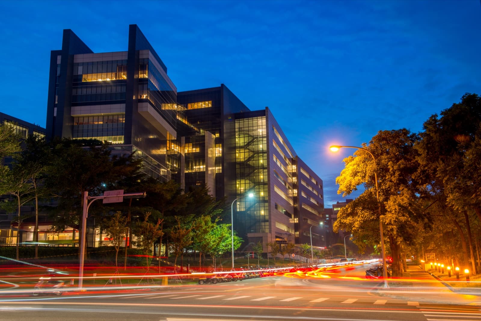TSMC's Fab 12A in Hsinchu. A fab is a building without windows or expression, yet its clean rooms hold the most advanced process nodes in the world — the fact on which Taiwan's security argument came to rest.
