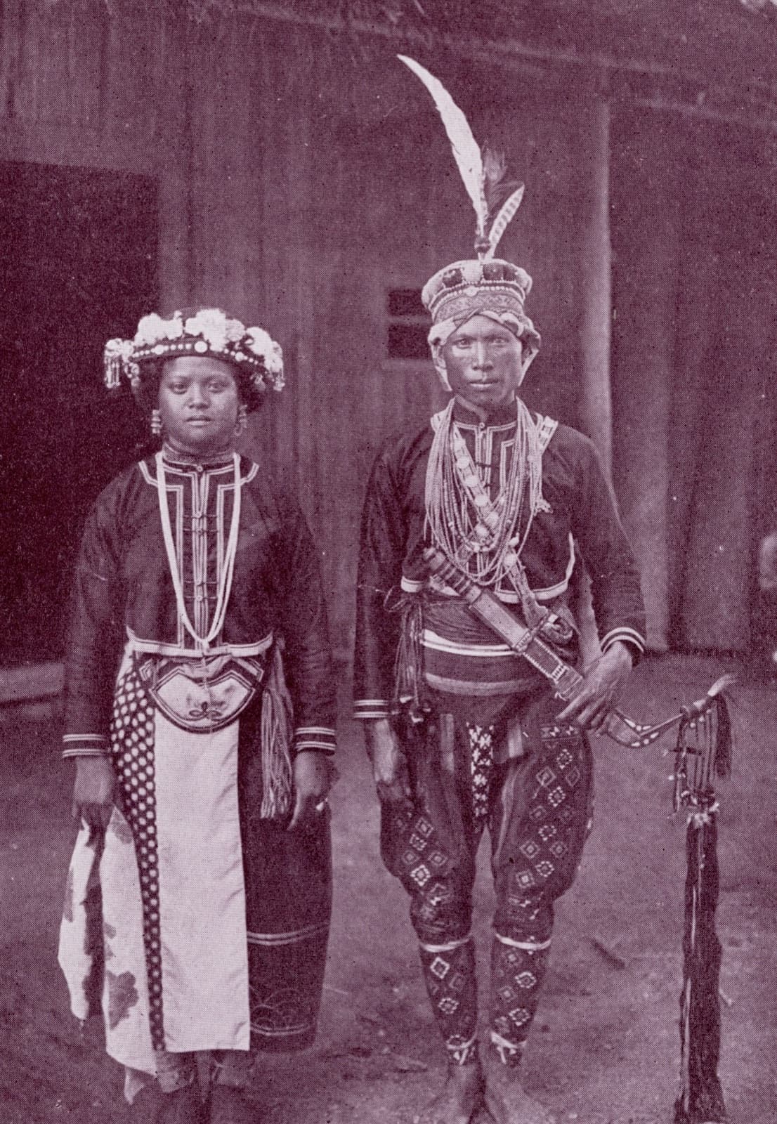 A man and a woman of Pimaba in formal dress, around 1930. The original caption singles out the fine embroidery on the betel bag slung across the man's shoulder and the silver chain on his chest. Three hundred years earlier, this was the village that allied with the Dutch East India Company and summoned the mountain chiefs on its behalf.