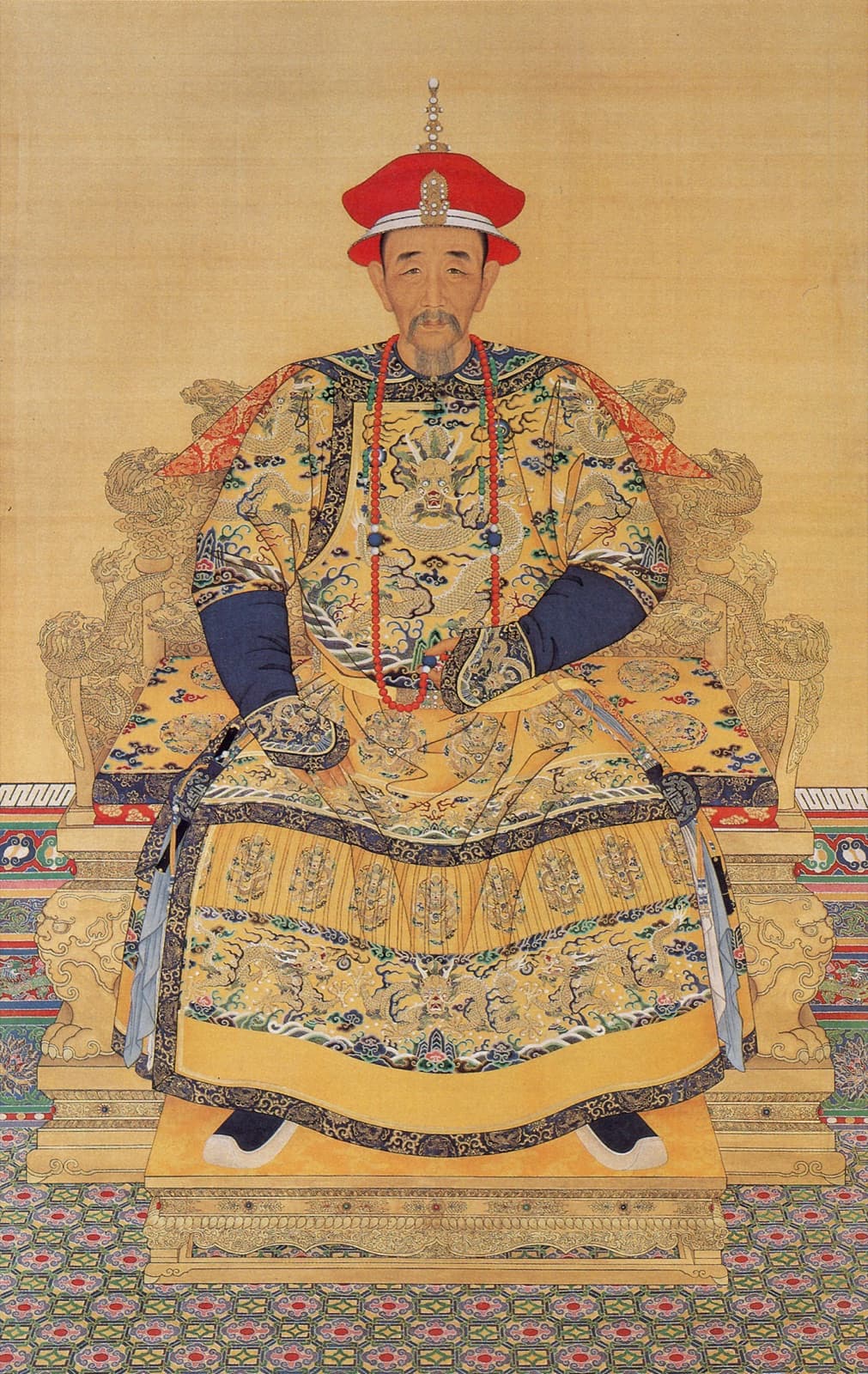 The Kangxi Emperor in court dress. He was twenty when the Three Feudatories rose; eight years later he had crushed them, and two years after that he took Taiwan. Zheng Jing's failed campaign cleared the young emperor's last obstacle.
