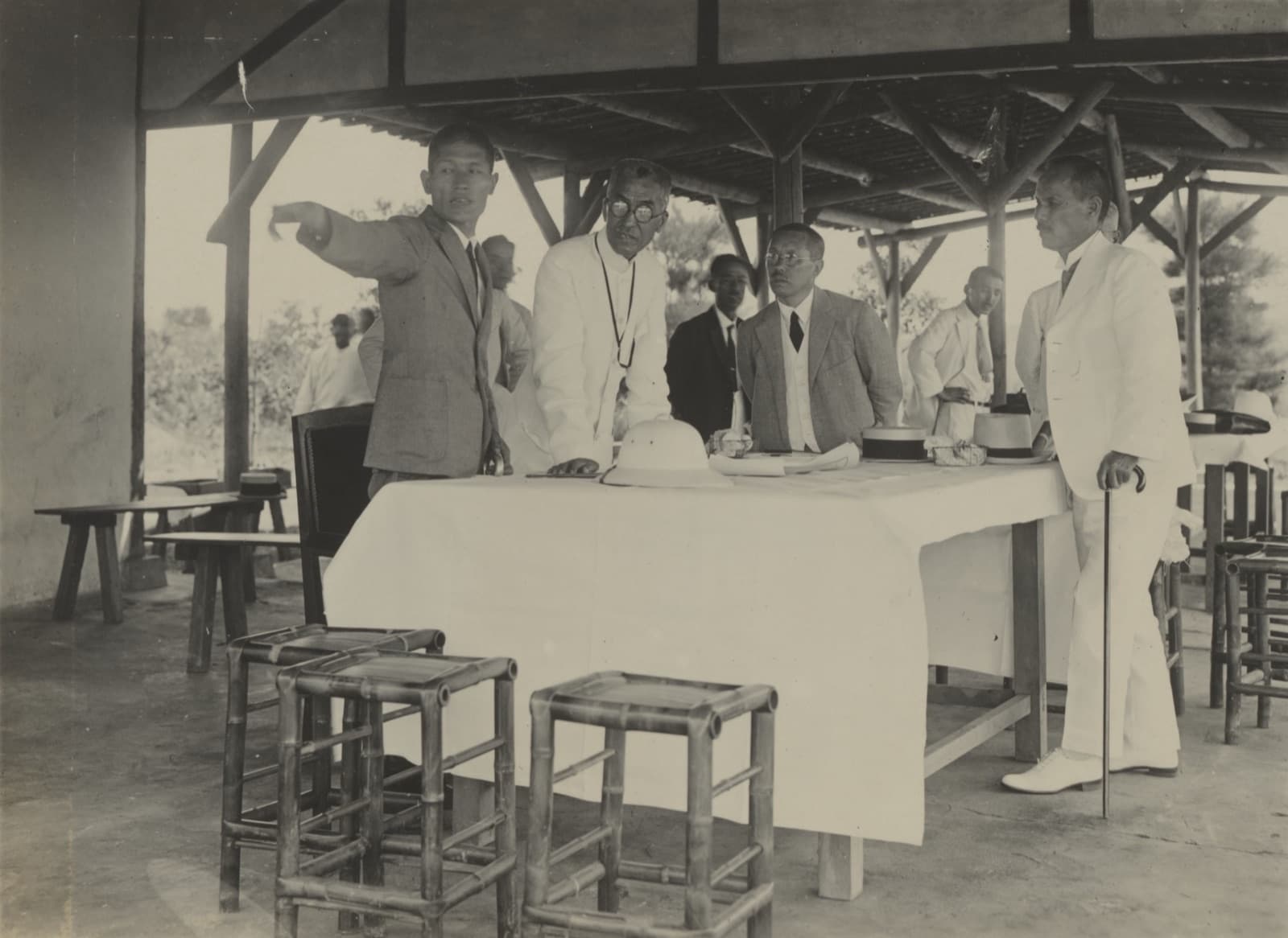 Governor-General Ishizuka Eizo receiving a briefing at Wushantou, 1929. The canal watered 150,000 hectares — at the price of a three-year rotation that took the choice of crop out of the farmers' hands.