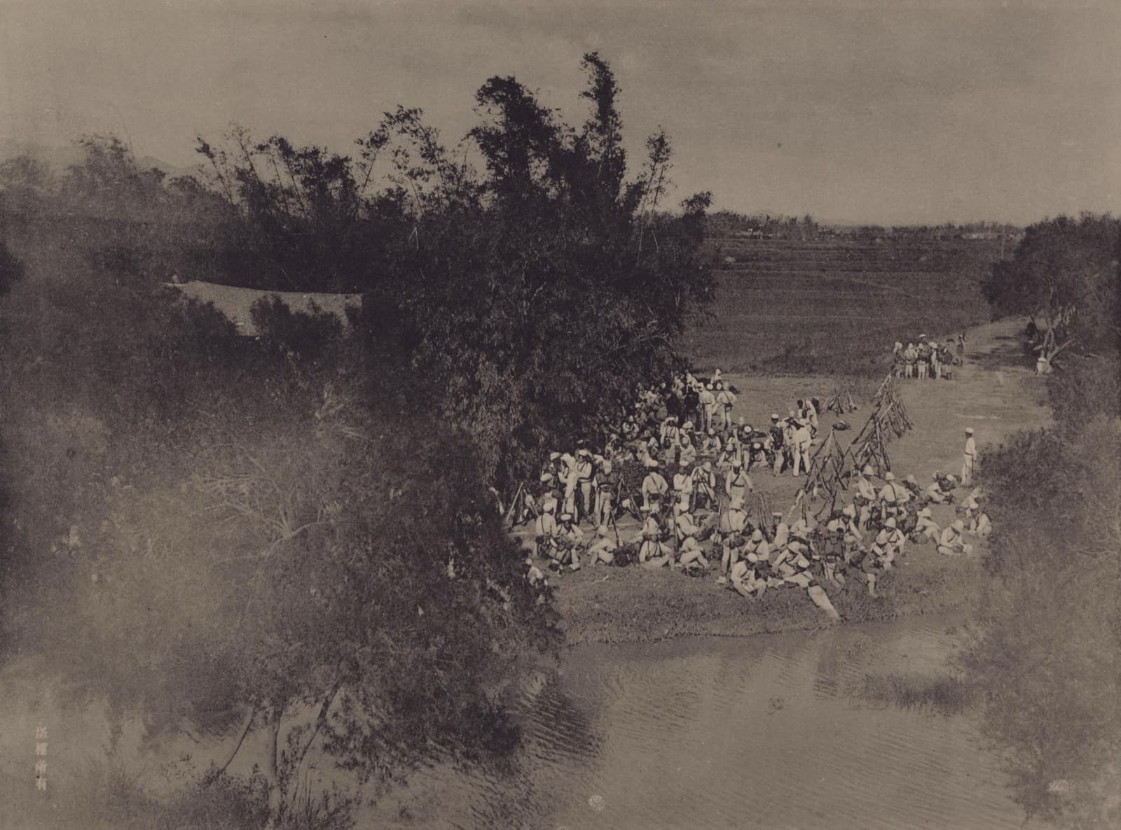 Men of the Japanese 5th Regiment resting outside Taipei's North Gate. After the city fell on 7 June 1895, this Qing-era gate became the passage in and out for the new administration.