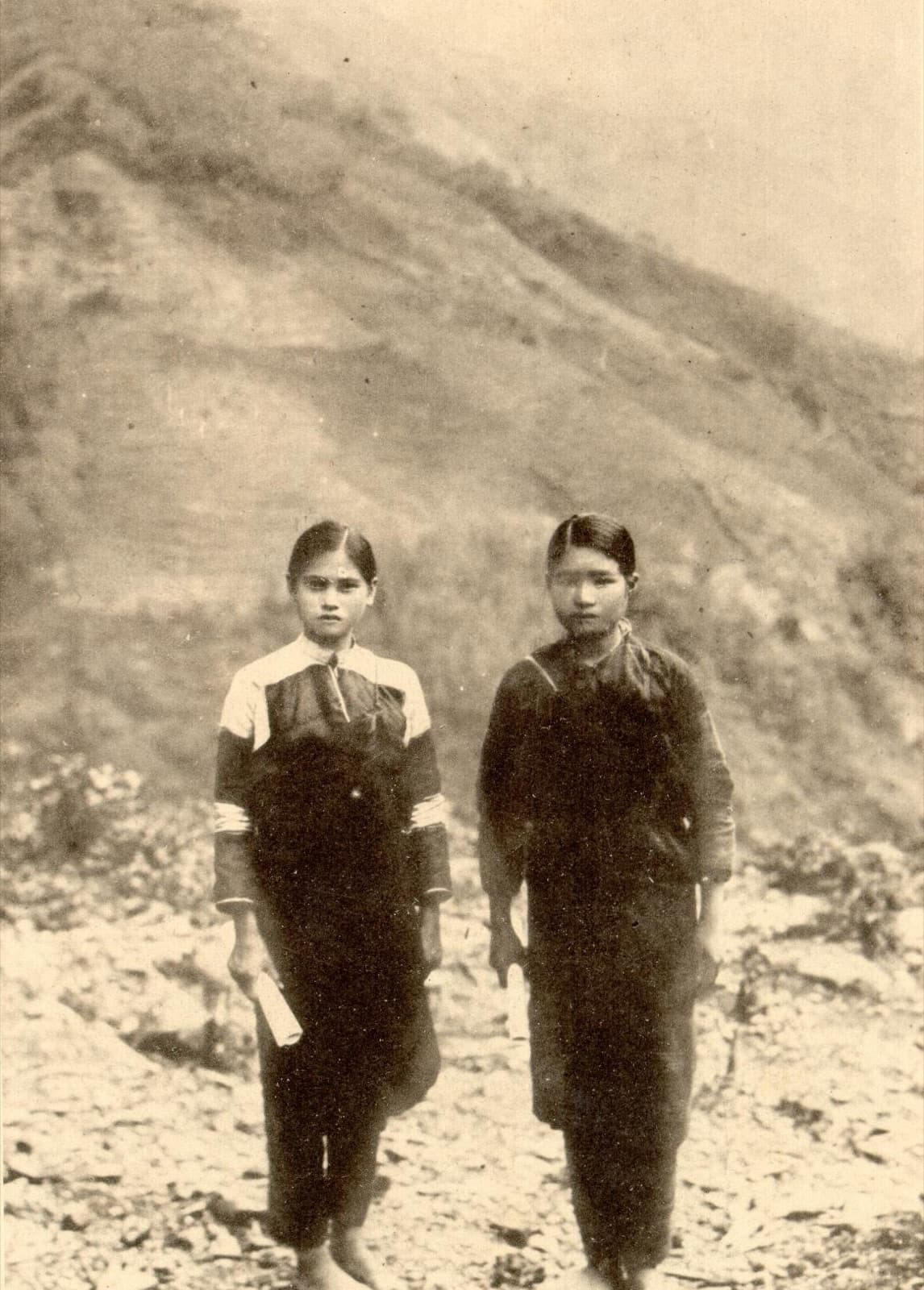 Indigenous women who led Japanese children to safety during the Musha Incident, holding certificates of appreciation from the authorities. In the same weeks, their own people were being hunted down.